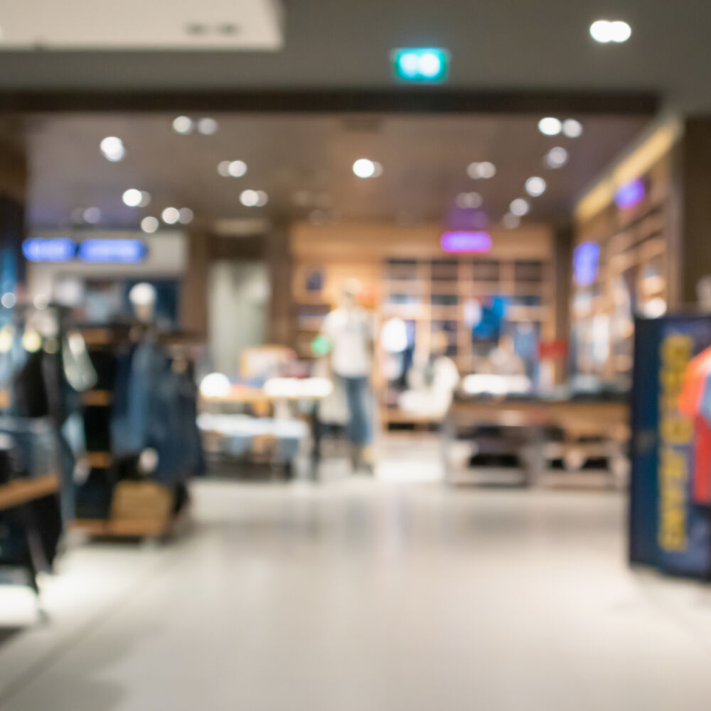 Abstract blur clothing store in modern shopping mall defocused background